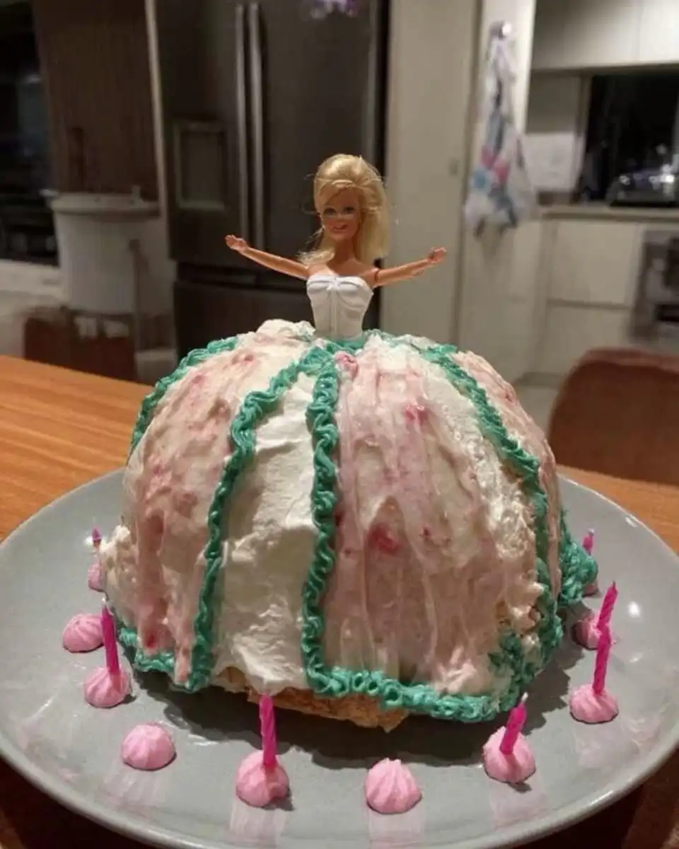 Barbie Cake 10 A golden dome shaped cake cooling on a rack before decoration