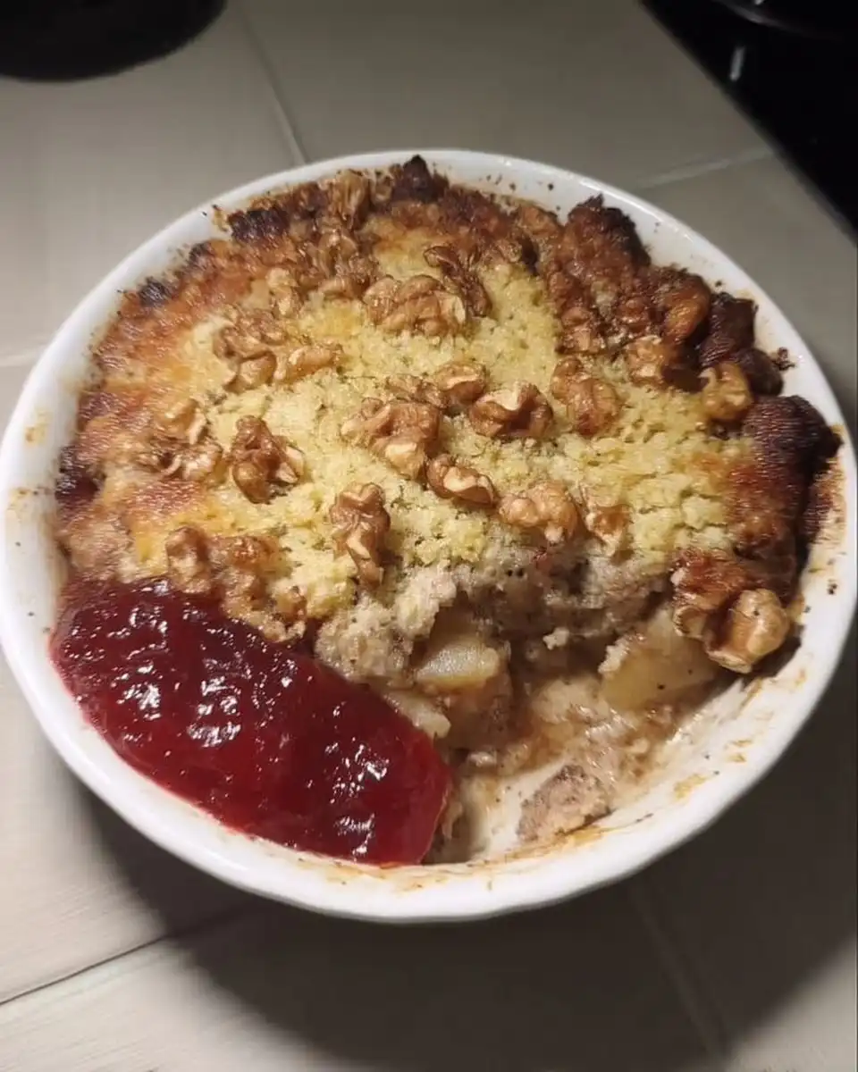 Apple Cranberry Dump Cake 13 Dump cake in pan topped with sliced butter and walnuts before baking