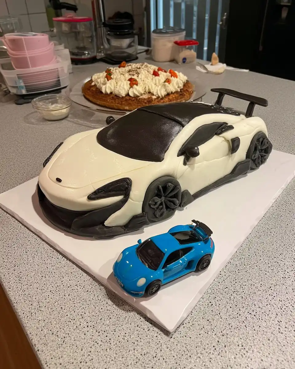 Car Cake 10 Red car cake shaped like a beetle with oreo wheels