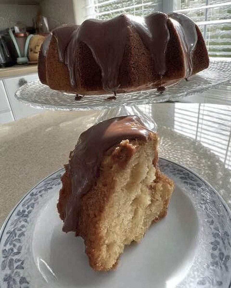 Butter and sugar being creamed in a mixer to pale yellow