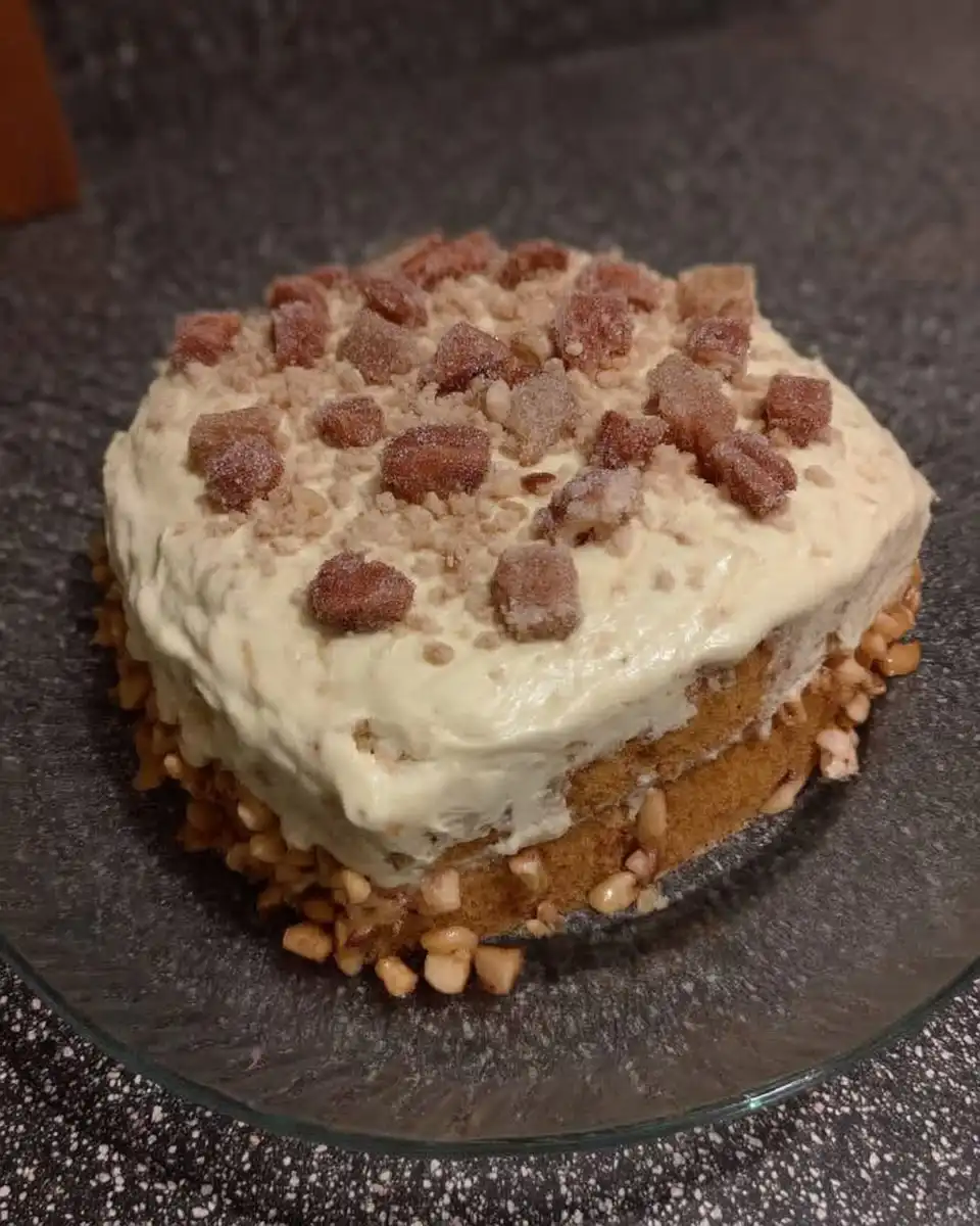 Whisking cooked flour frosting for eggnog cake