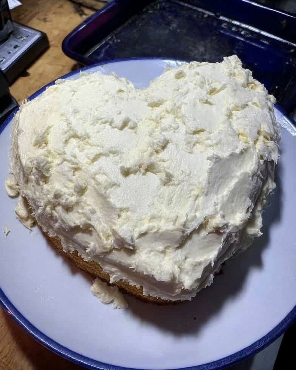 Valentine Cake 12 Baking ingredients including butter sugar eggs and almond extract on a counter