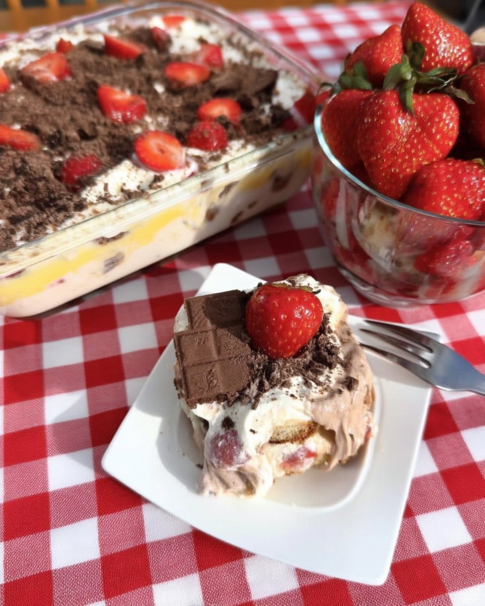 Strawberry Icebox Cake 12 Fresh strawberries chocolate pudding and graham crackers on a table