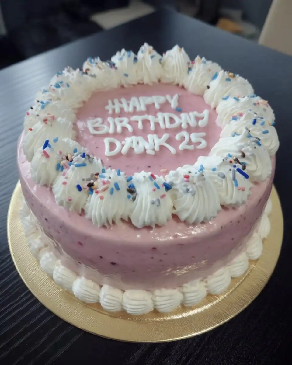 Frosted minimal cake with rainbow sprinkles