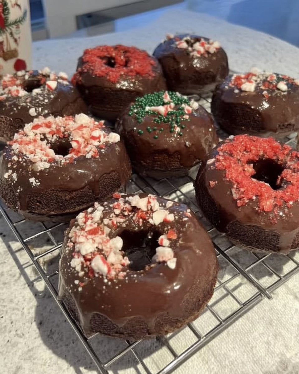 Slice of peppermint chocolate cake showing moist dark crumb and white frosting
