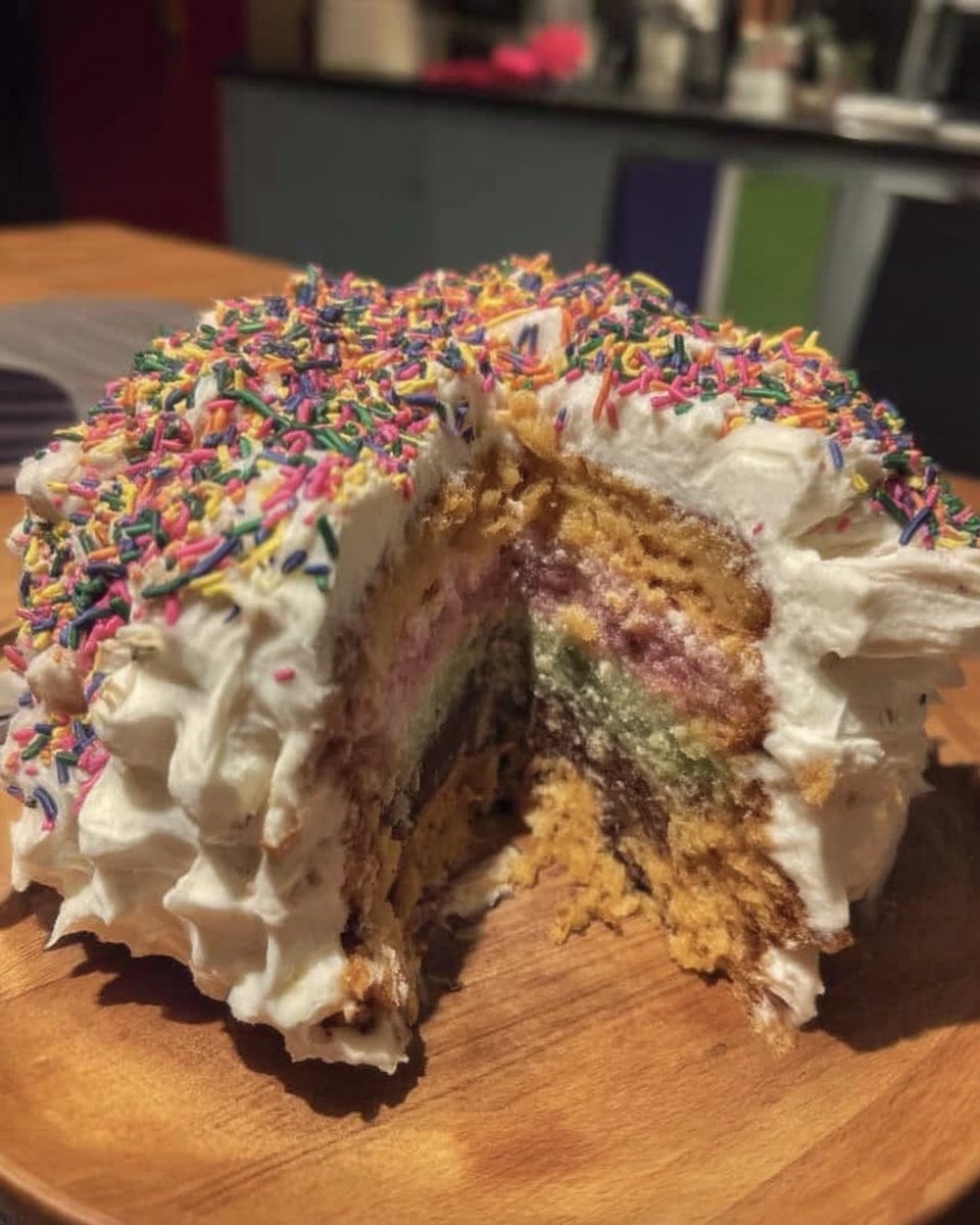 Ingredients for pinata cake including butter eggs and gel colors