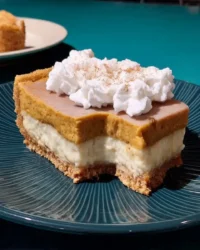 Slice of no bake pumpkin cheesecake with gingersnap crust