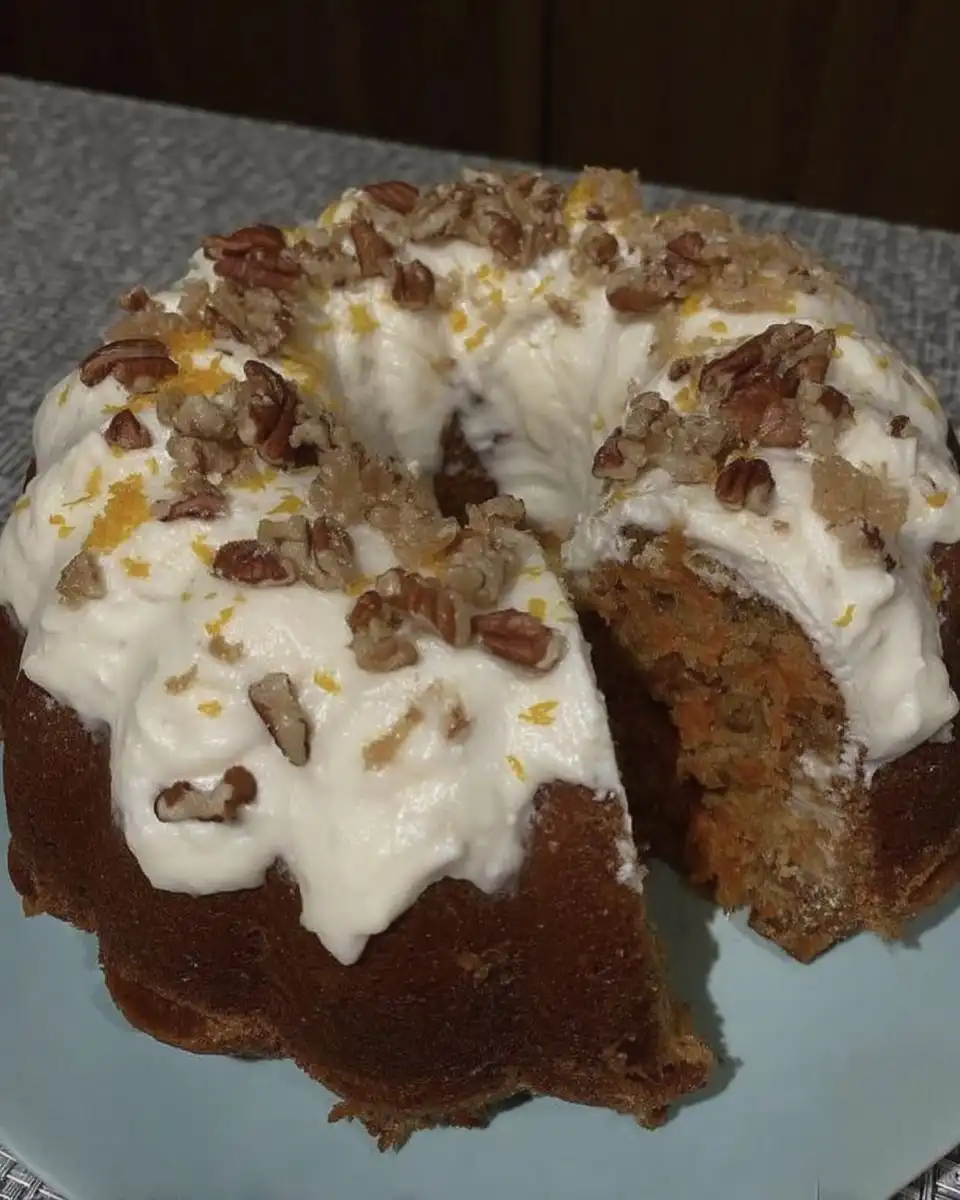 Carrot Cake Recipe 14 Plated carrot cake slice with pecan garnish ready to serve