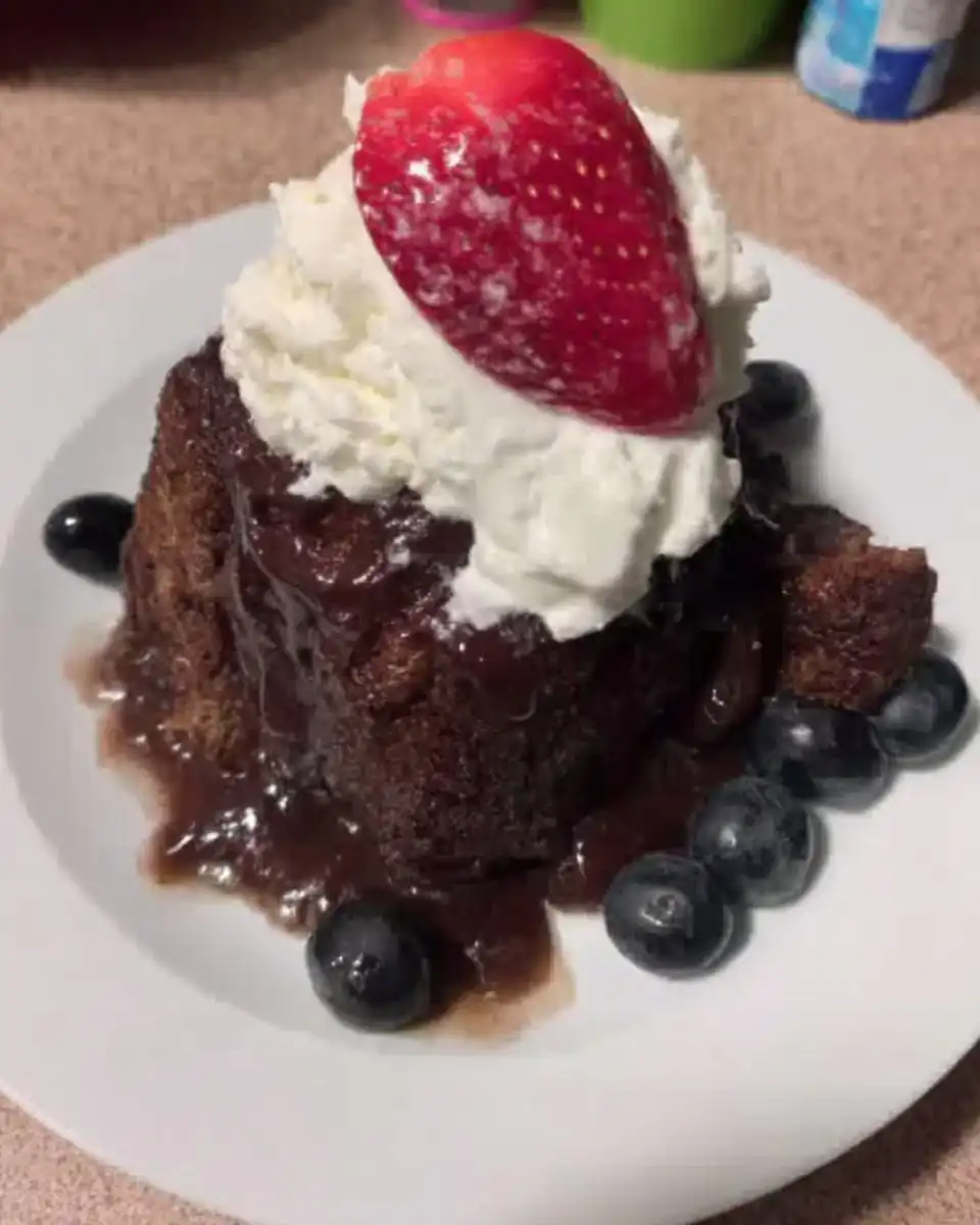 Slice of nutella cake served on a white plate