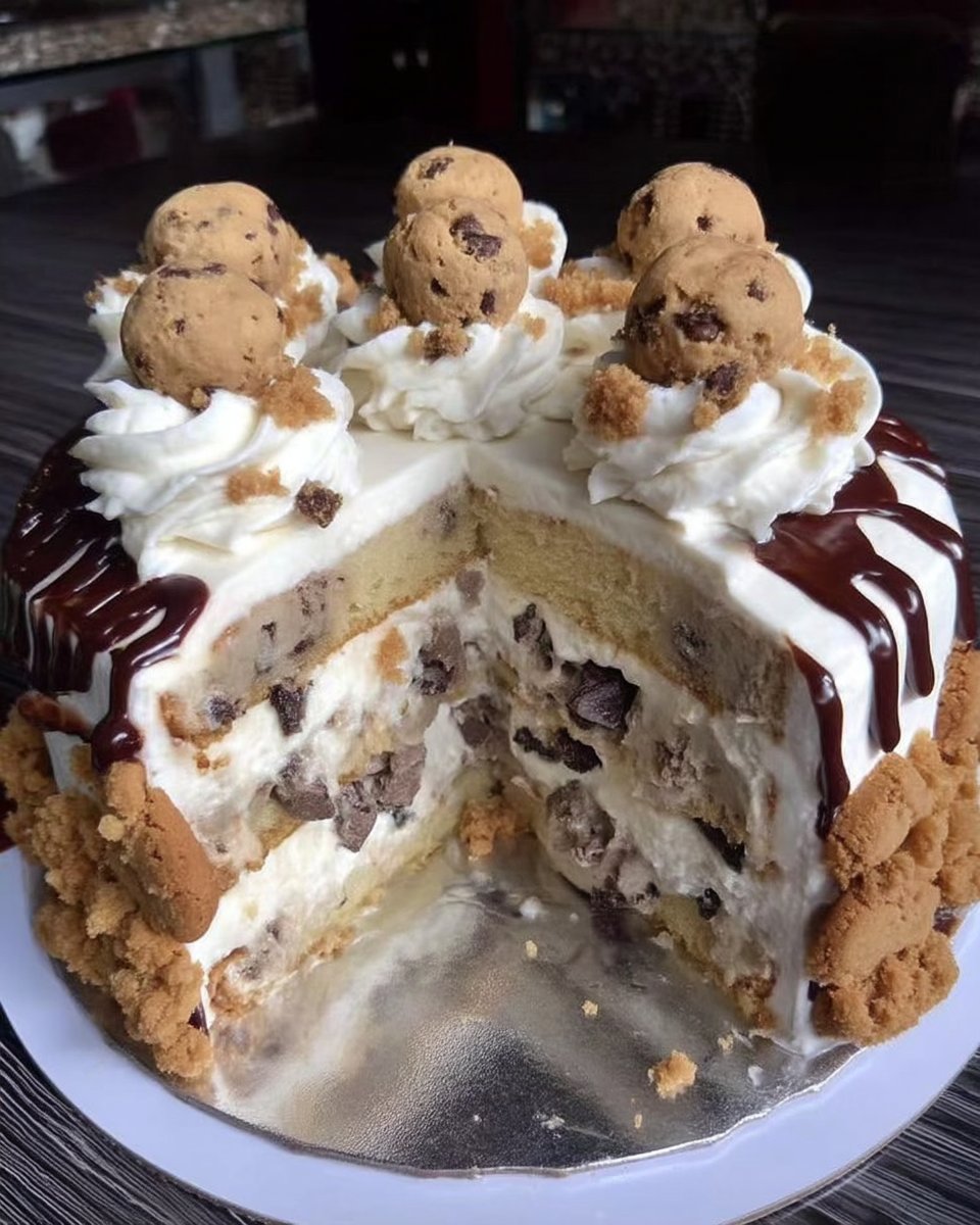 Sliced cookies and cream cake served on a white plate with a fork