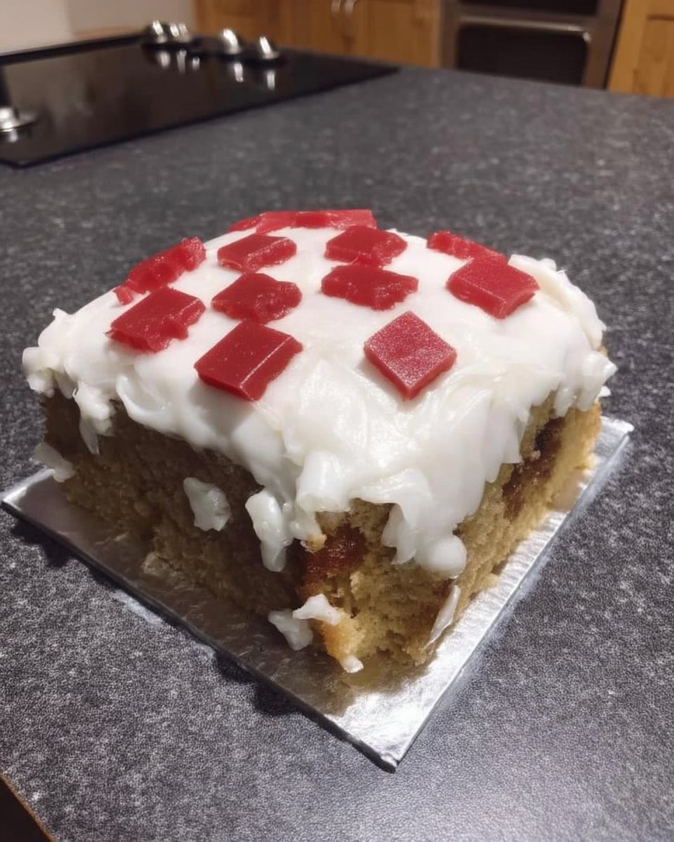 Minecraft Cake 14 Sliced square of minecraft cake showing chocolate layers and jam filling