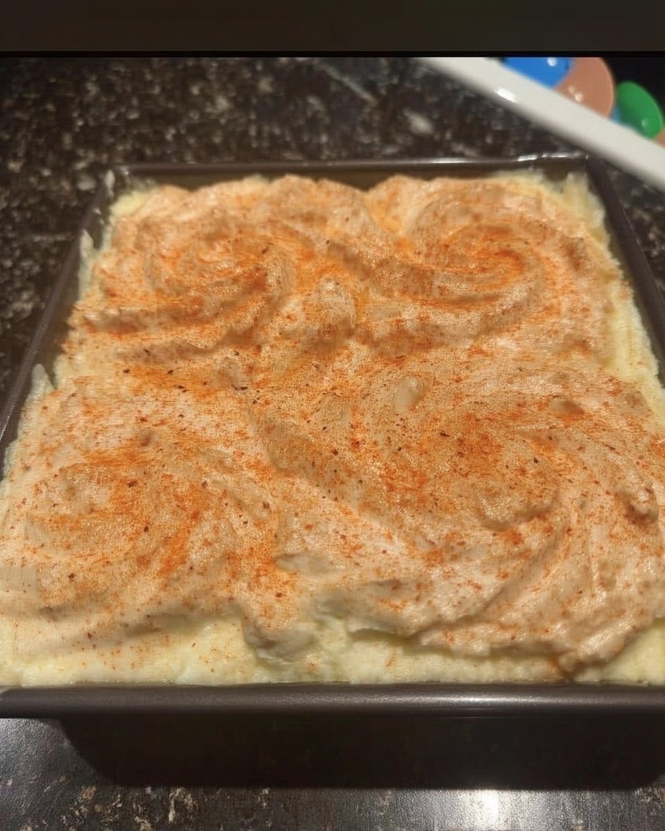 Sliced velvet spray cake revealing layers of mousse and the thin outer chocolate shell