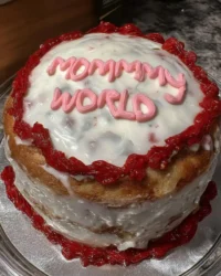 Tender slice of white Mothers Day cake with chocolate and vanilla frosting