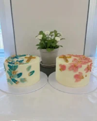 A close up shot of a white baptism cake with a light and airy vanilla crumb