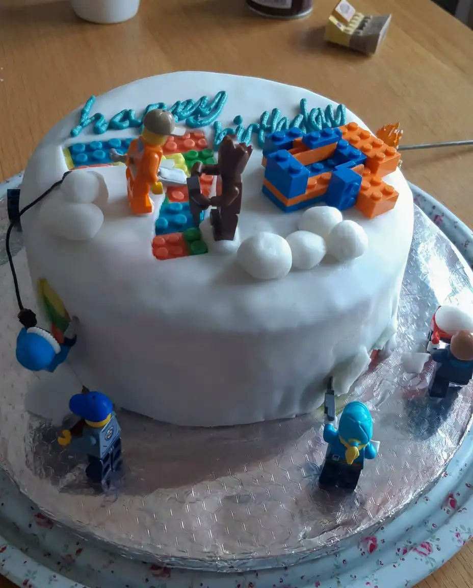 Boys Cake 10 A rectangular cake decorated like a green soccer pitch with player figurines and a ball
