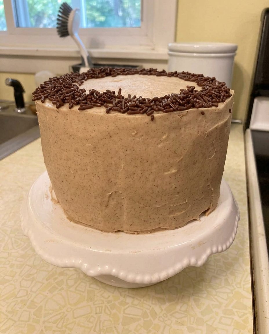 A close up of a small cake slice with a golden crumb and soft texture