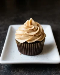 A small chocolate cake with a dark rich crumb and smooth frosting