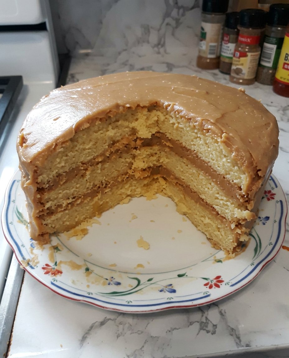 A close up of the moist velvet crumb of a caramel cake