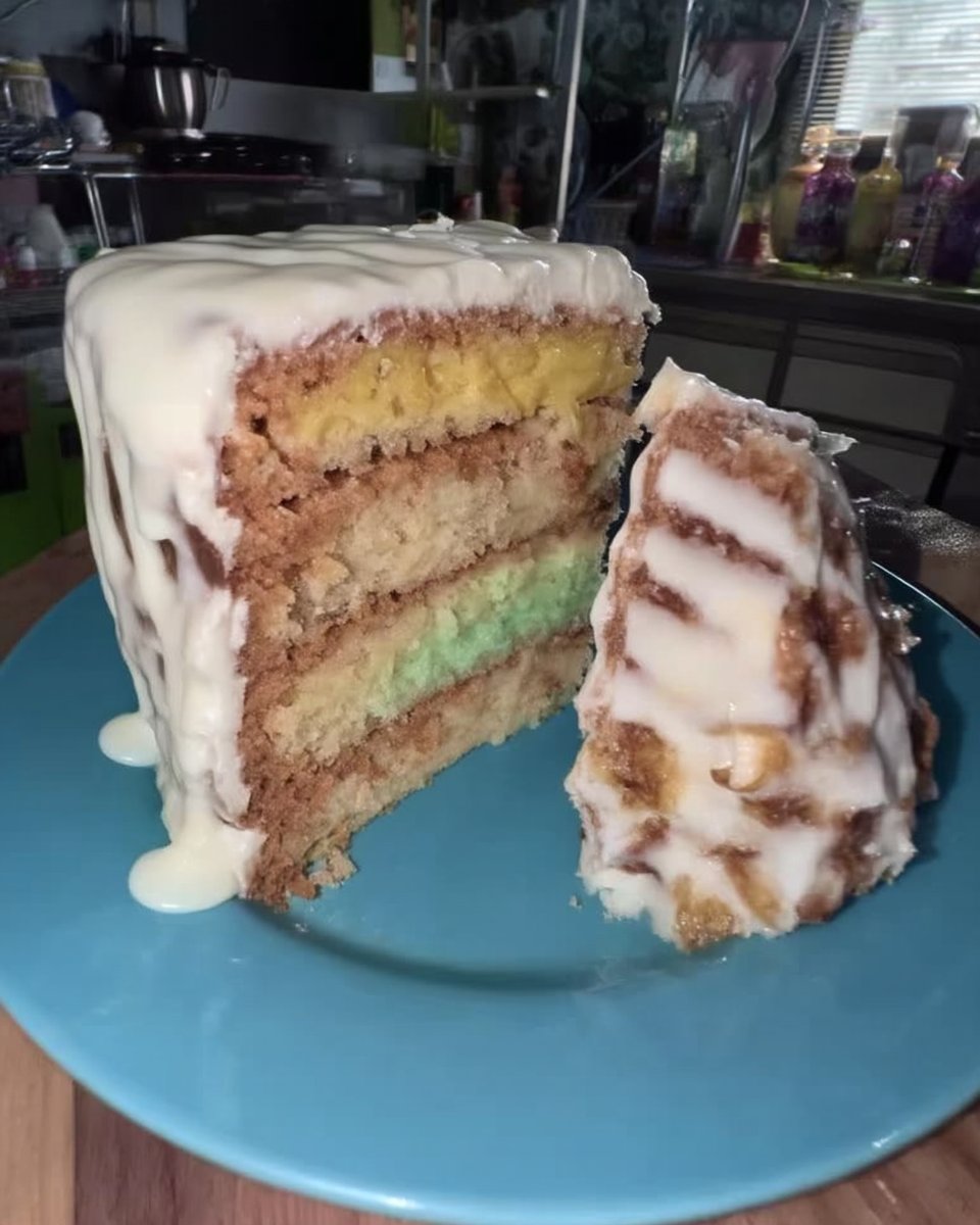 Lemon Rainbow Cake 2 13 Creamy white shortening and sugar being mixed in a glass bowl