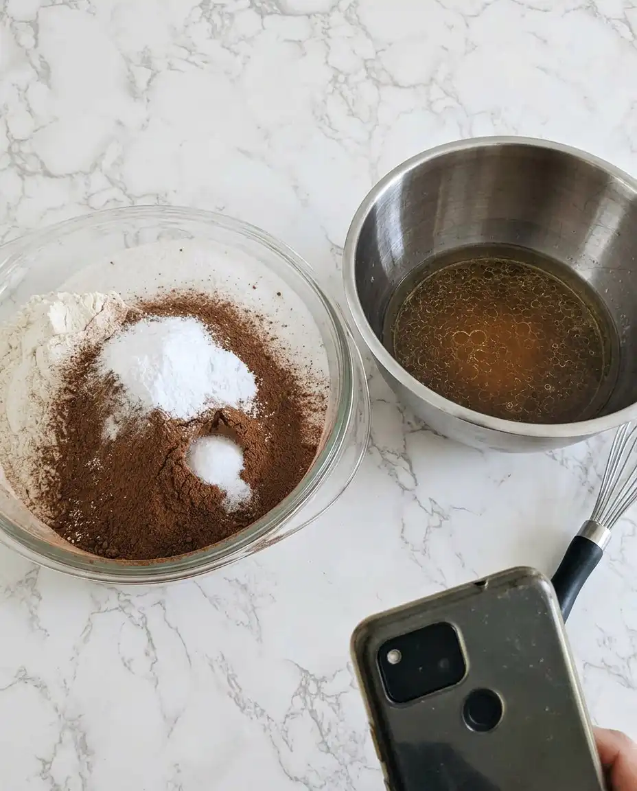 A 3D ball pan and 6 inch cake pan next to bags of cake mix and frosting