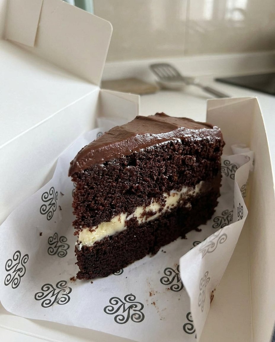 Slice Cake 12 Baking ingredients including eggs flour sugar and lemon zest on a wooden table