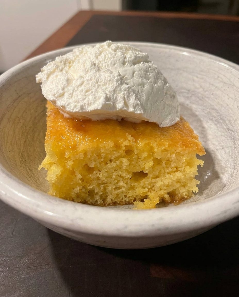 Fresh lemons, zest, cake mix, and pudding mix on a wooden table