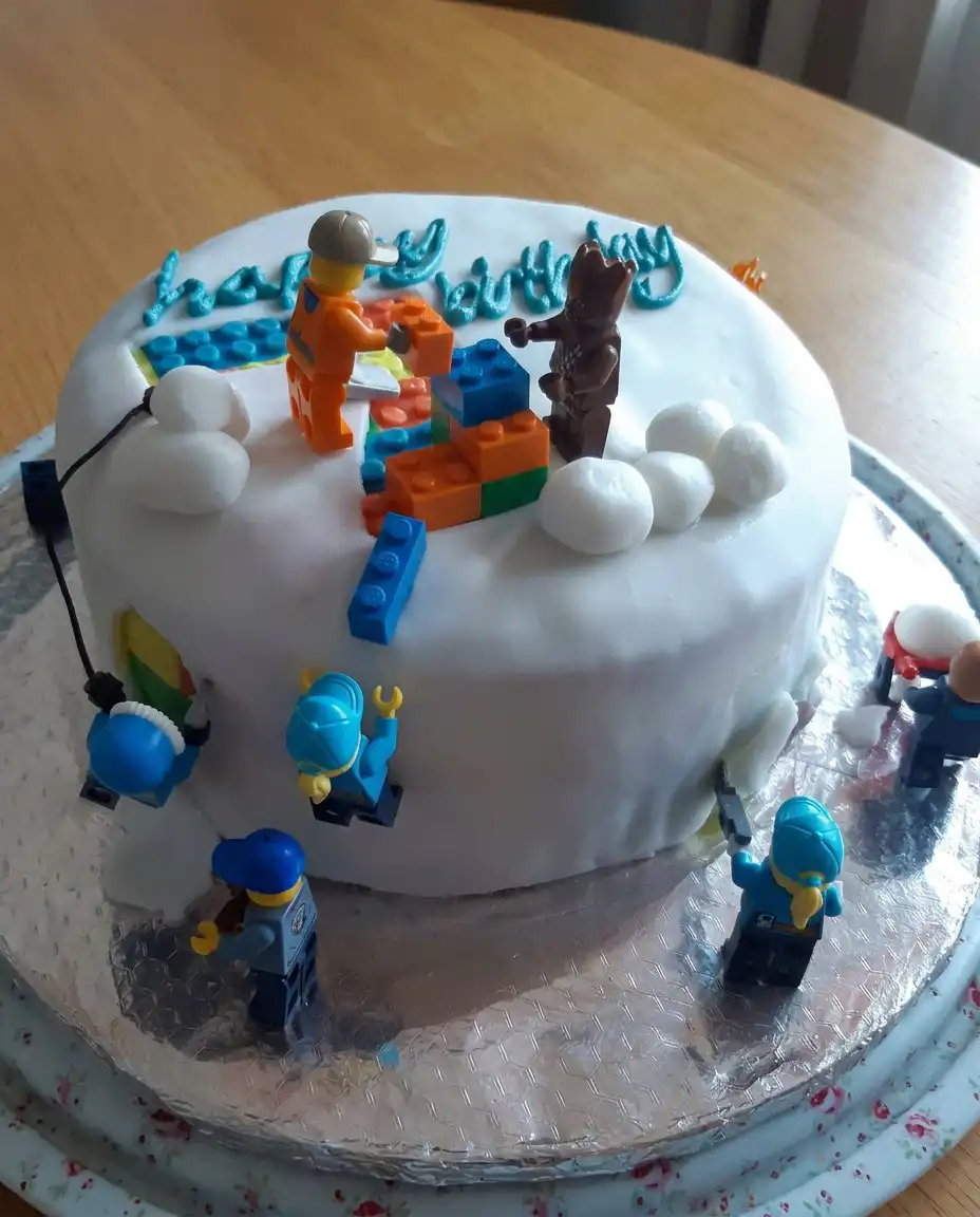 Boys Cake 14 A square slice of soccer cake on a white plate with a fork