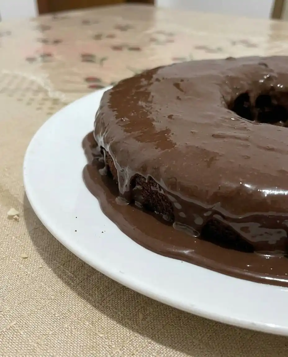 Chocolate Cake 14 A perfectly sliced piece of chocolate cake on a white plate