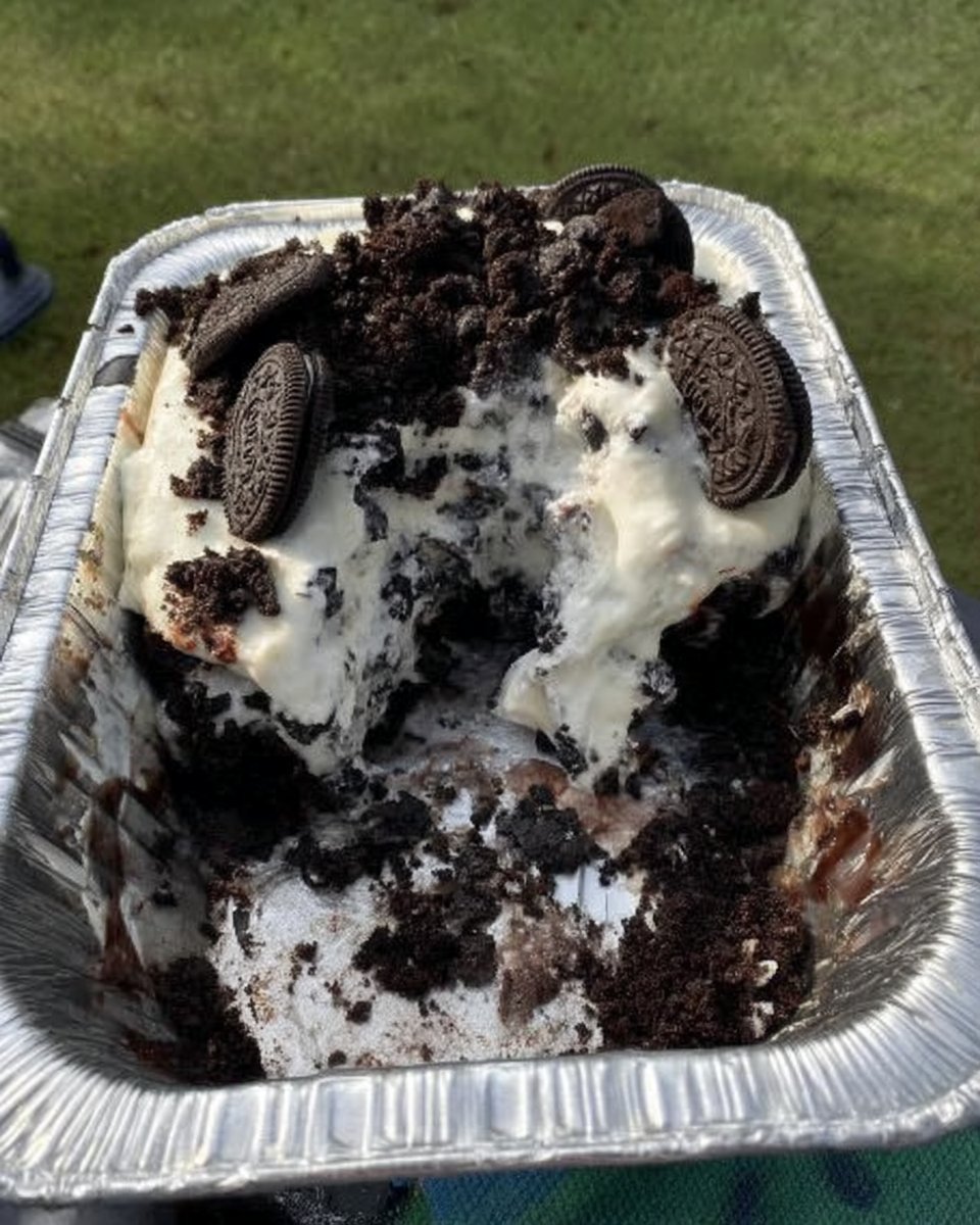 Close up of whipped cream at stiff peaks stage in a metal bowl