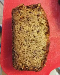 A moist slice of banana coffee cake with a thick cinnamon crumb topping