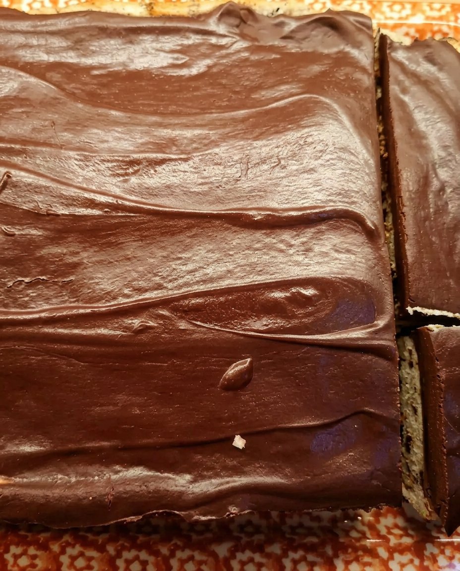 Chocolate ganache cake served with a scoop of vanilla ice cream