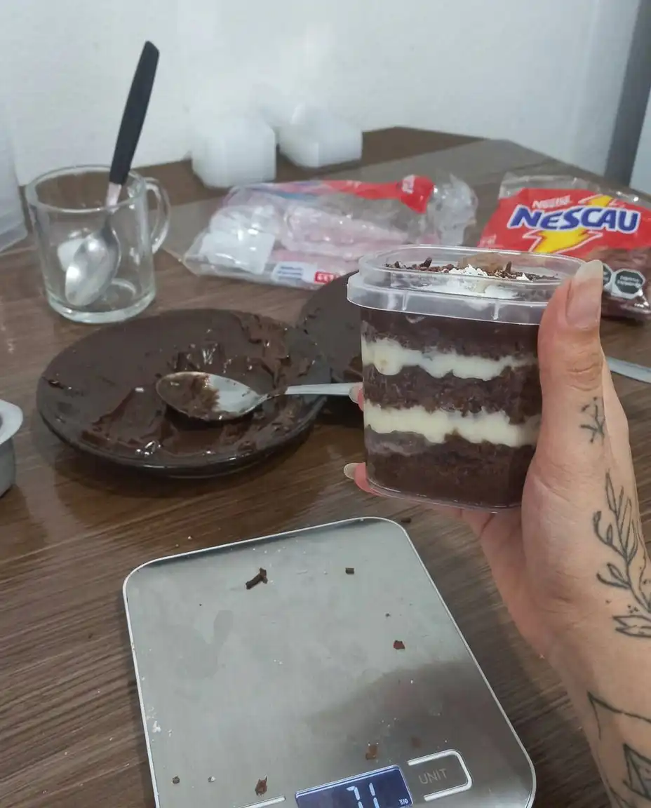 A group of finished jar cakes with lids and decorative spoons