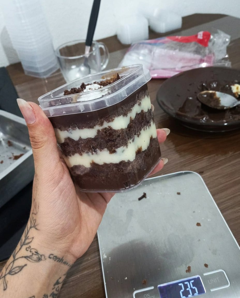 A close up view of precise layers in a jar cake showing the crumb and frosting