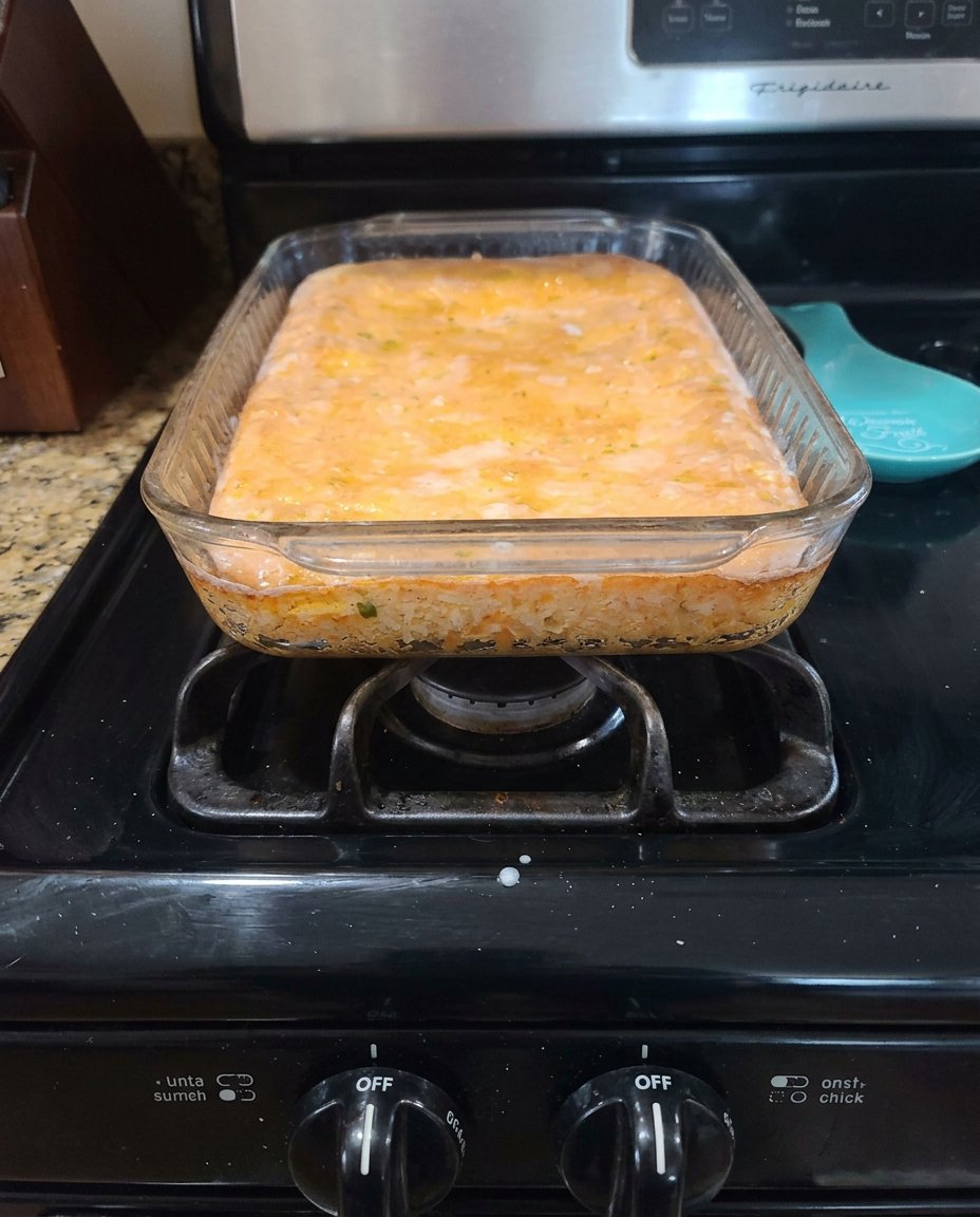 Fresh lemons, powdered sugar, and baking ingredients arranged on a rustic table