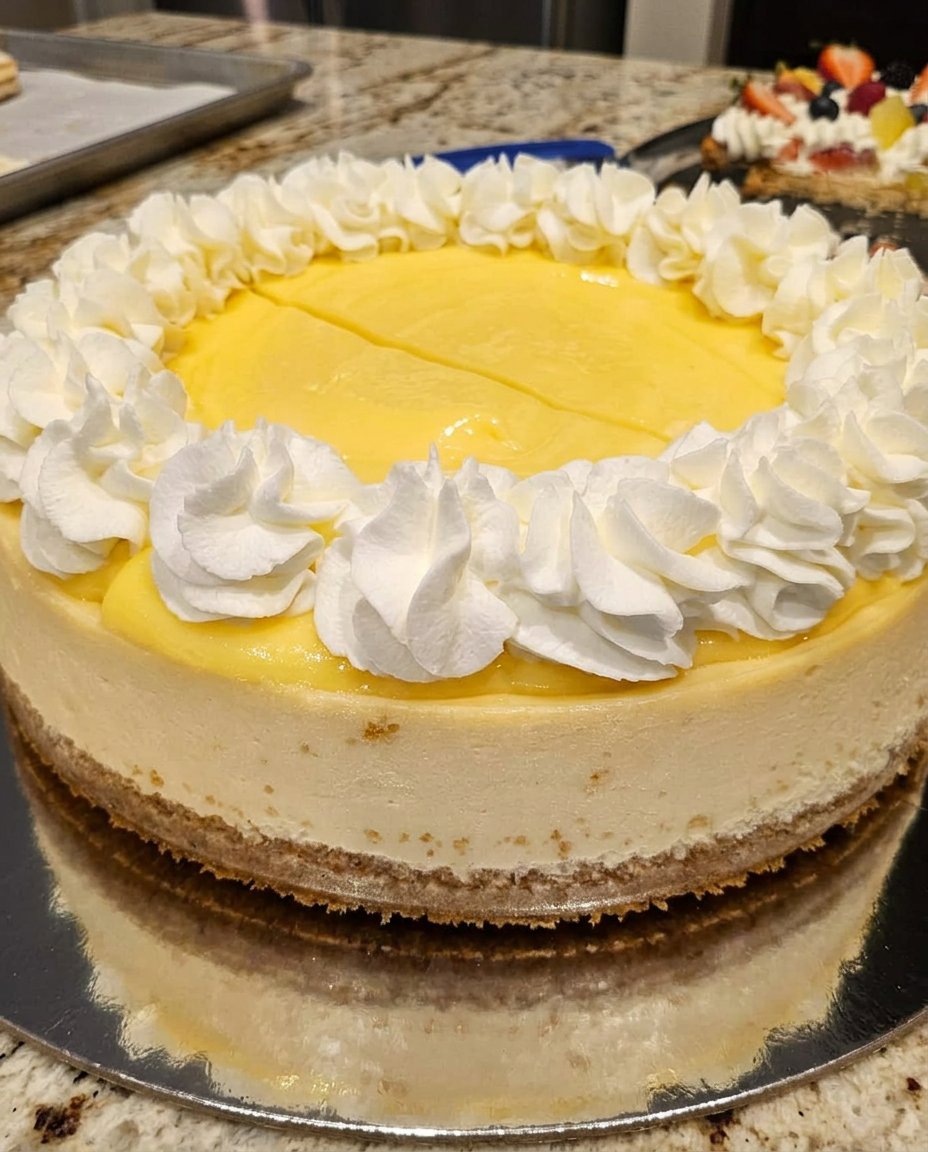 A table set with lemon cheesecake and a cup of coffee