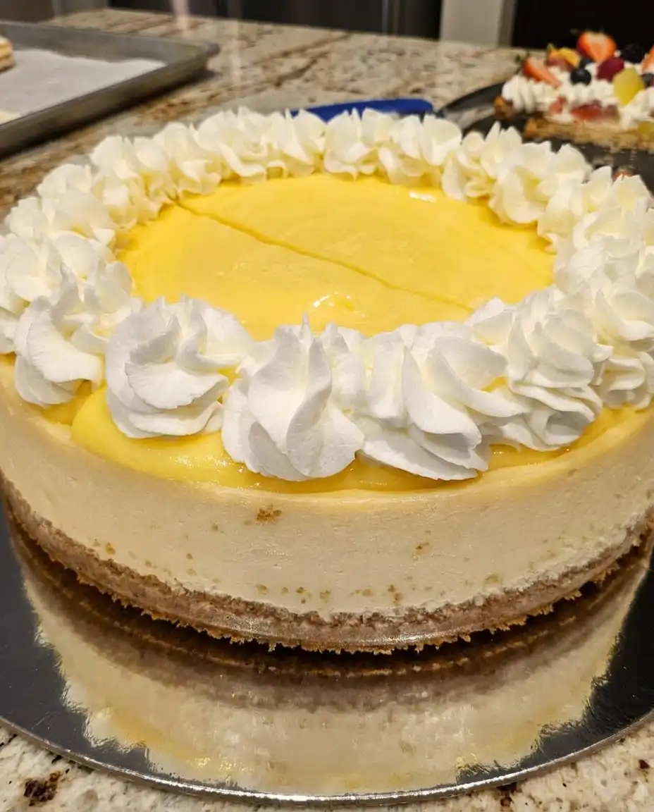 A table set with lemon cheesecake and a cup of coffee