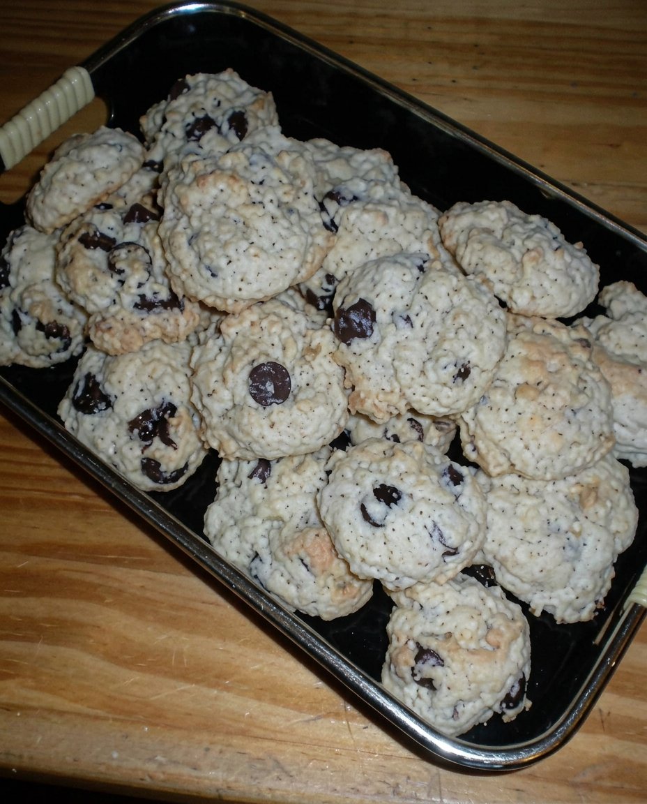 Chocolate ganache dripping down the side of a blue frosted cake.