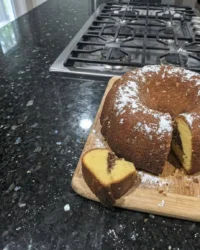 A perfectly baked Sock It To Me Cake showing a delicate crumb and crisp pecan streusel ribbon