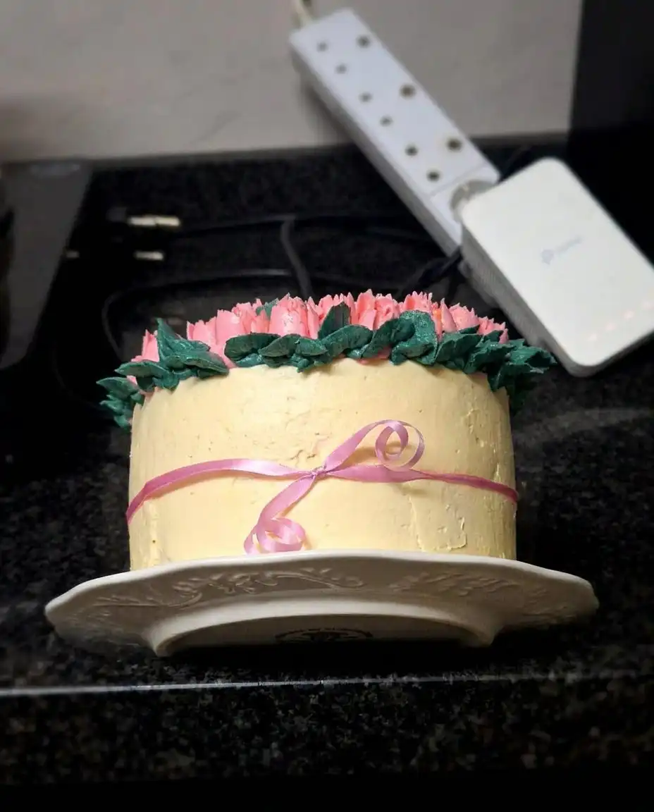 Tulip Cake 10 A beautiful one-layer cake topped with ivory and purple buttercream tulips and pearls.