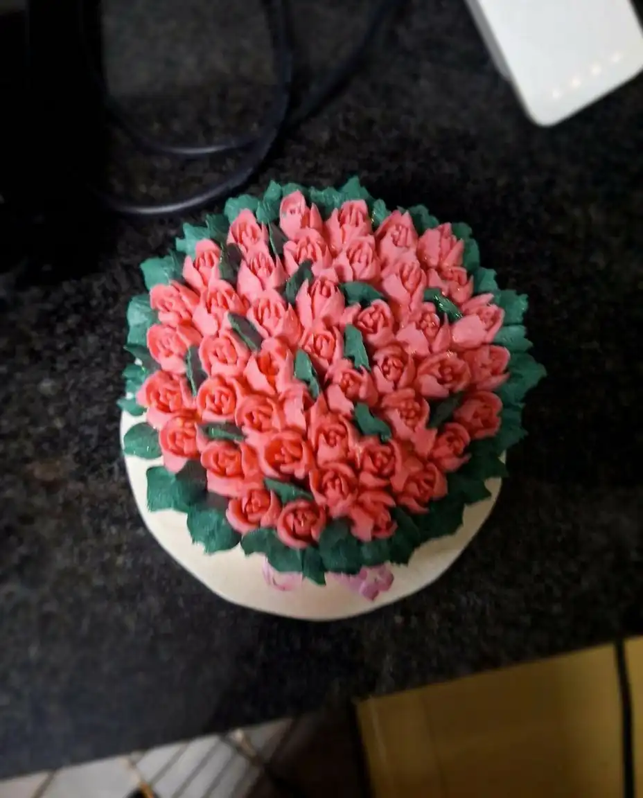 Tulip Cake 12 Multiple bowls of icing in burgundy, moss green, and ivory shades.