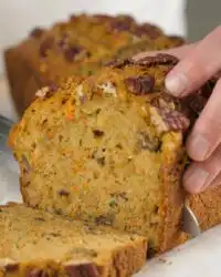 Close up of the moist crumb and grated vegetables in carrot apple zucchini bread