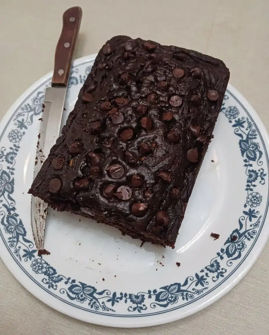Whole loaf of chocolate zucchini bread cooling on a wire rack