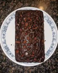 Slices of moist chocolate zucchini bread showing dark cocoa crumb and chocolate chips