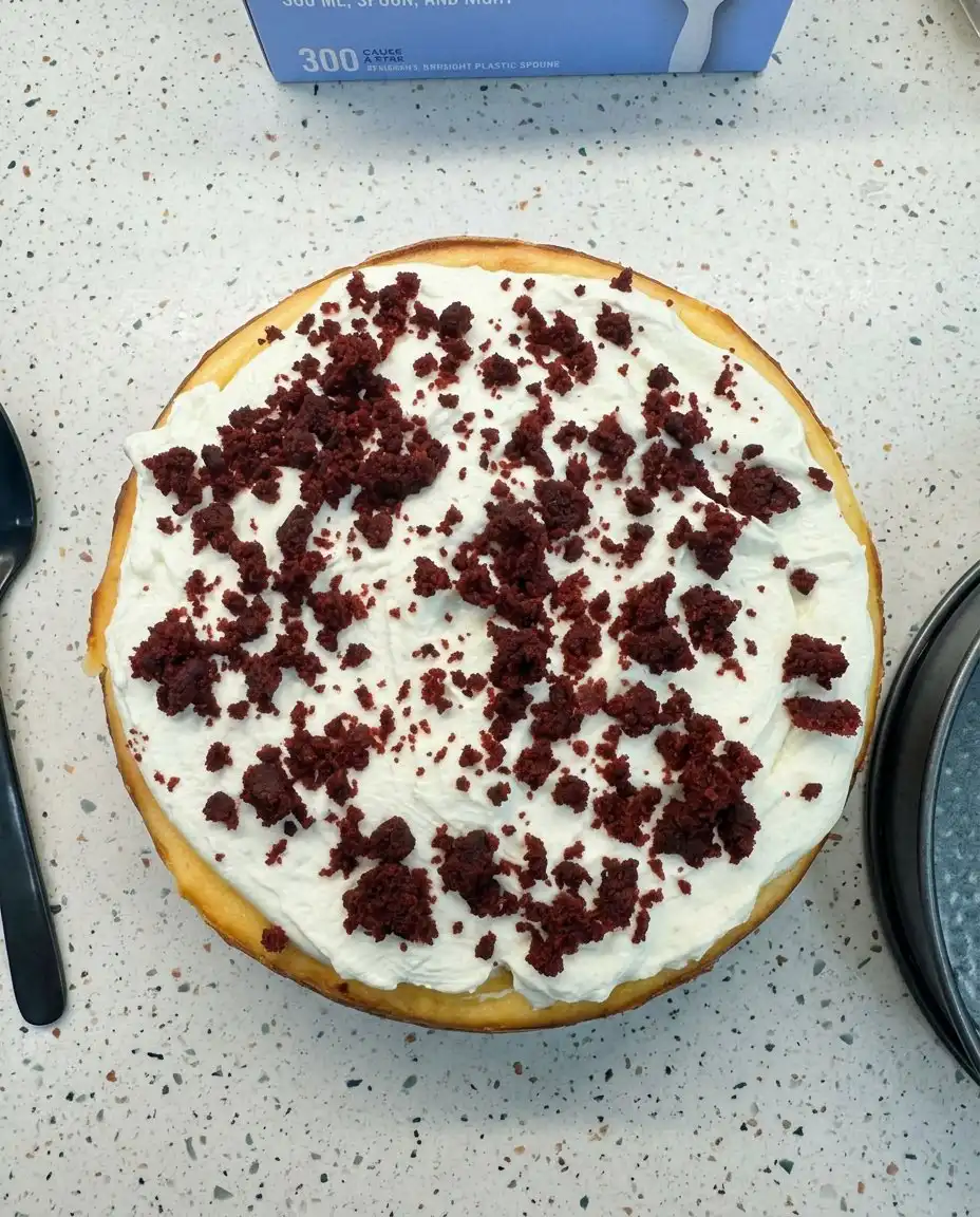 Red Velvet Cheesecake 14 A perfectly clean slice of red velvet cheesecake on a white plate