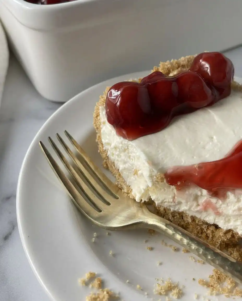 Smooth and thick cream cheese filling being folded with whipped cream