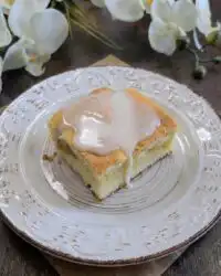 A close up of sliced Peaches and Cream Bars showing the fruit and cream layers.