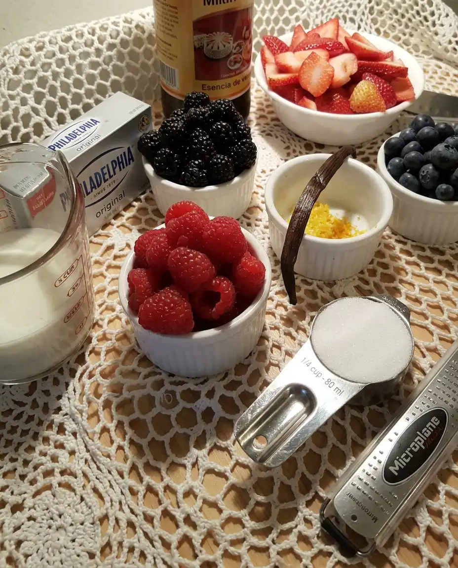 Freshly sliced strawberries and whole blueberries prepared for a dessert salad