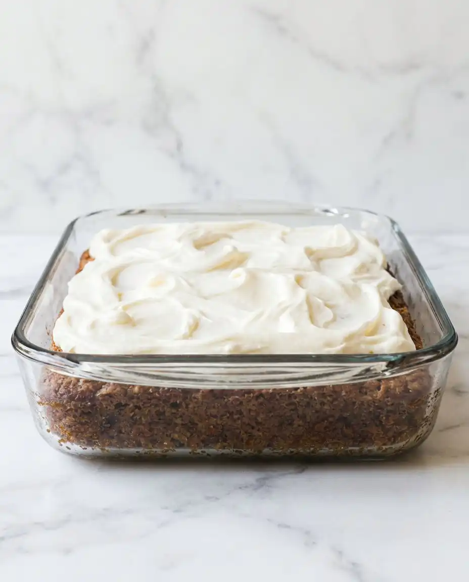 A tray of Old-Fashioned Zucchini Cake slices ready to be served at a kitchen table.
