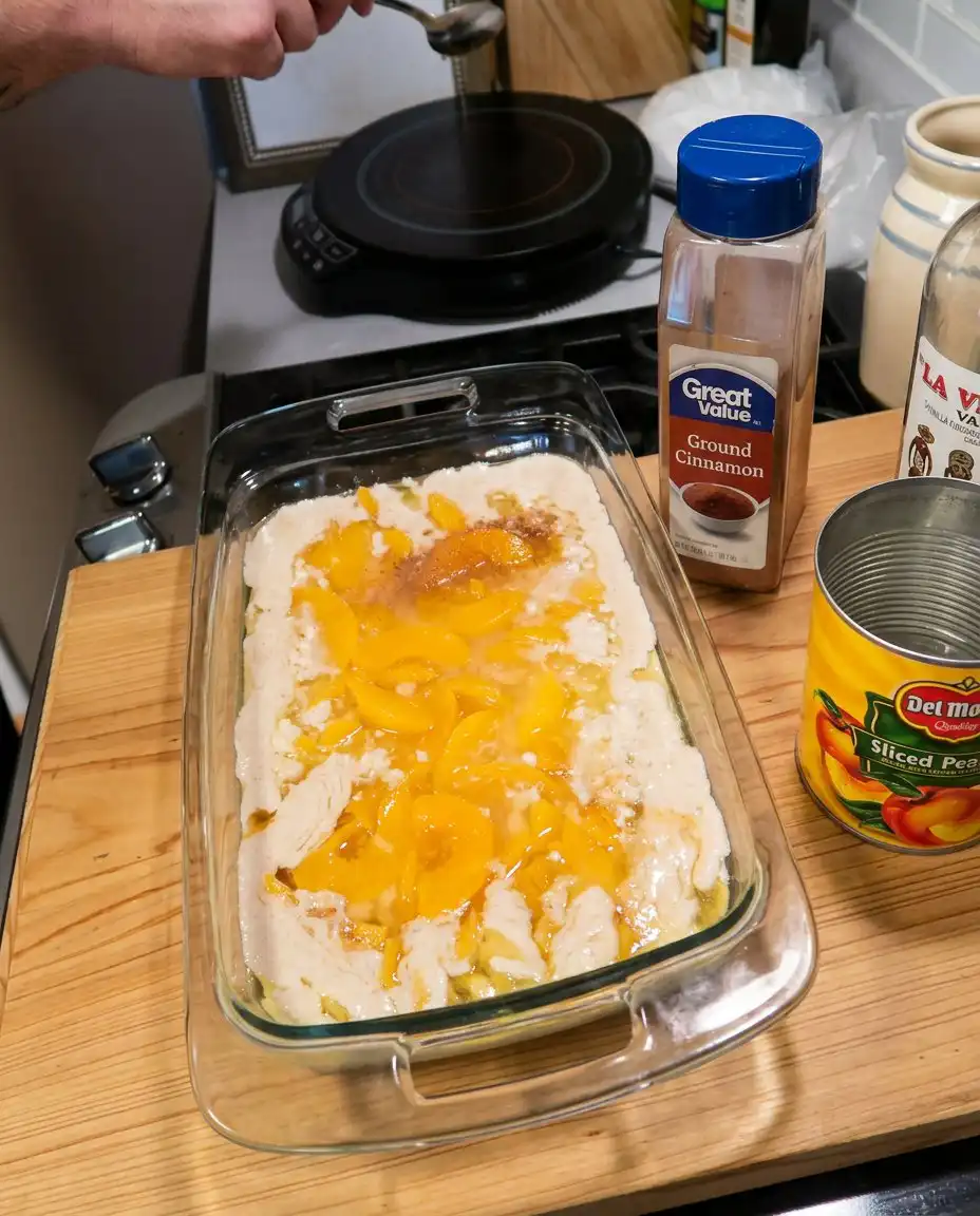Close up of the textured golden crust of a peach cobbler