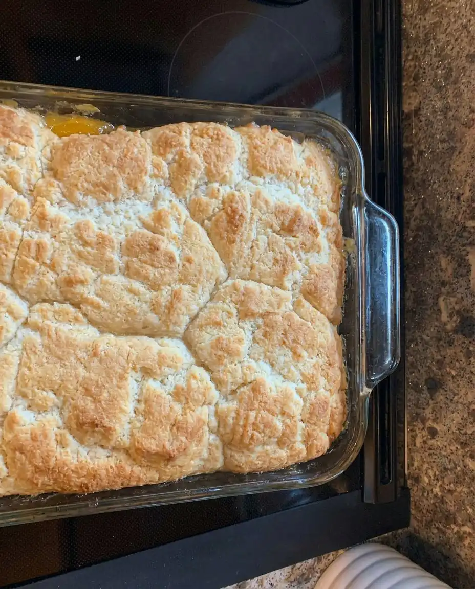 Patti Labelle’s Peach Cobbler 10 A golden brown Patti Labelle’s Peach Cobbler bubbling in a glass baking dish